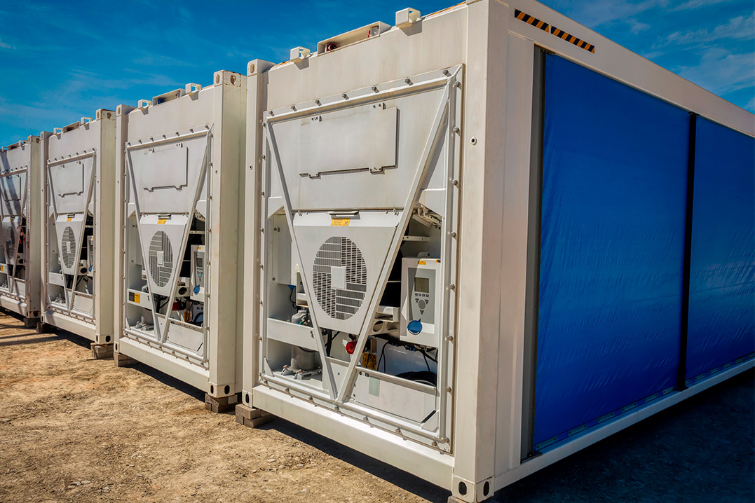 White and blue air-conditioned shipping containers lined up, illustrating choices for potential buyers in Texas.