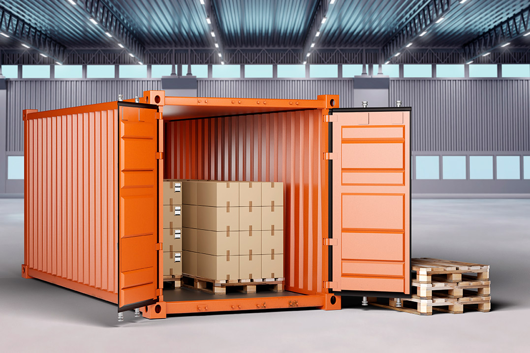 An orange storage container with a wooden pallet inside, symbolizing efficient business storage solutions.