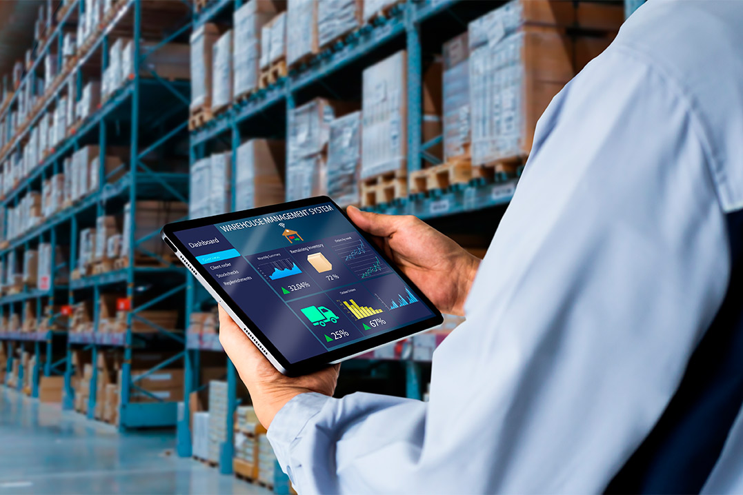 In a warehouse, a man uses a tablet, highlighting how 3PL services in Edinburg, TX can enhance business operations.