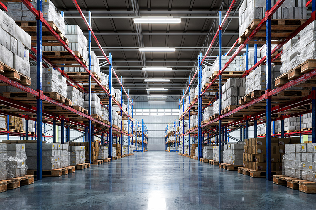 Interior view of a warehouse showcasing numerous shelves and pallets, highlighting 3PL bonded warehousing solutions.