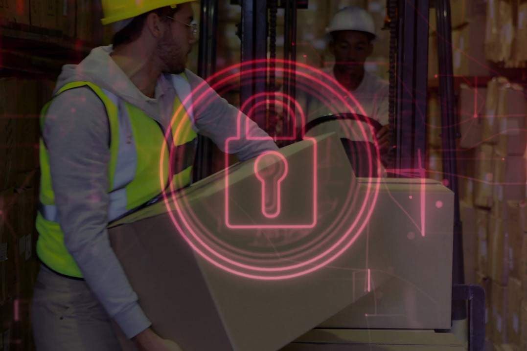 A man wearing a hard hat stands with a padlocked box, representing CBP Bonded Warehouse compliance checklist.