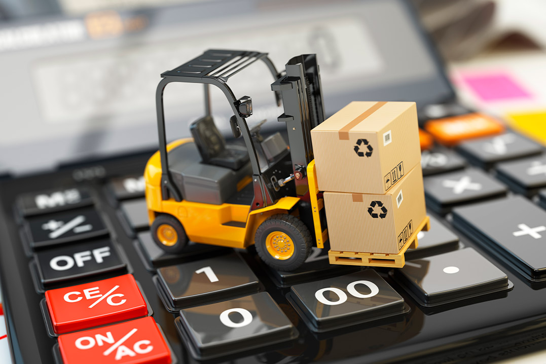 A forklift truck atop a calculator, illustrating the relationship between warehousing logistics and trade zone calculations.